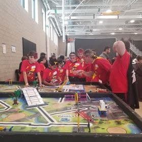 Coach B with robotics team at state